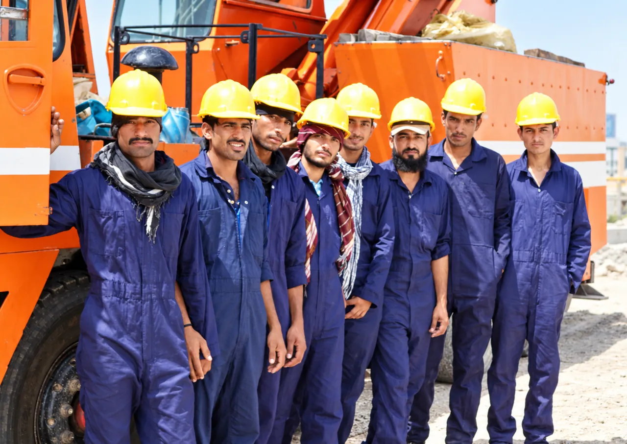 Enhanced company archive group photograph of construction workers